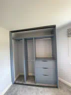Denim blue wardrobe with lots of hanging and drawers, fitted in Ingleby Barwick